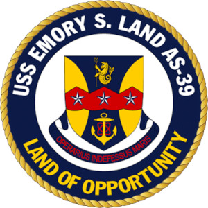 USS Emory S. Land with tug boat